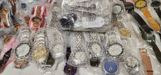 Multiple Watches, Apple Watch Charger, and Wrist Band And Scarf.  