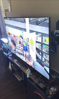 65" samsung TV with entertainment stand