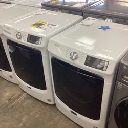 Four. 5 ft.³ front load washer and gas dryer set 