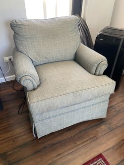 Rocking lounge armchair