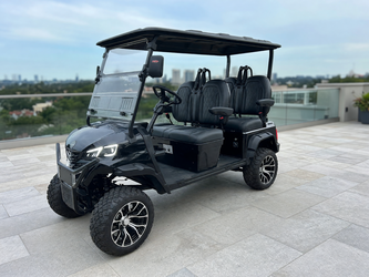 Black lifted 4-seater golf cart with custom wheels 2026 in like new condition