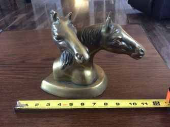 Real nice pair of brass horse heads.