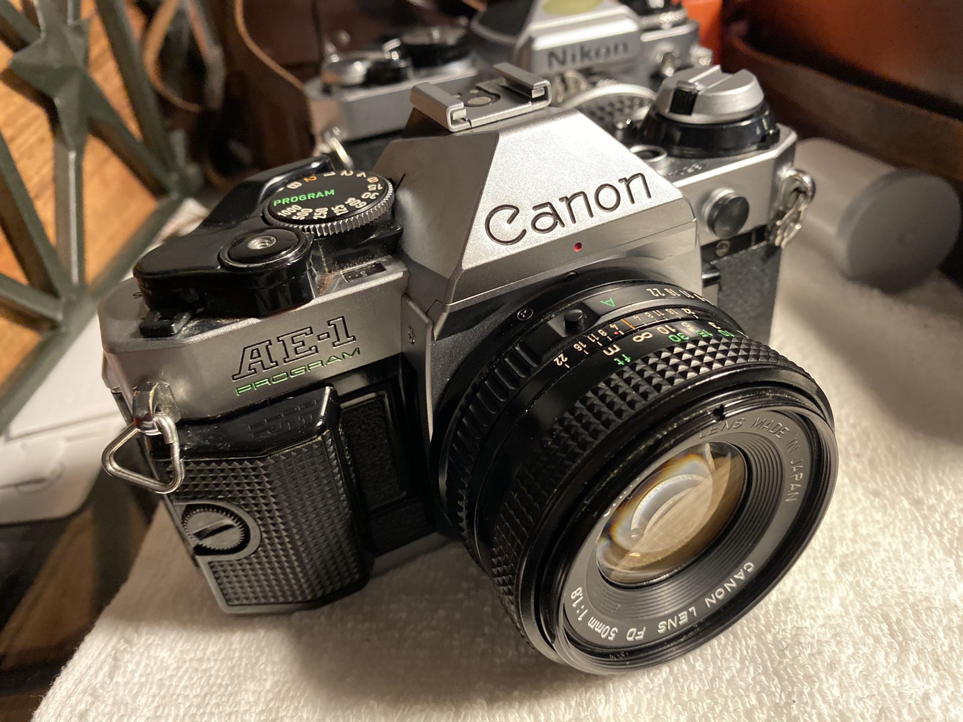 Canon AE1 Program 35 mm slr film camera w canon 50mm f1.8 lens No Squeak Meter works good