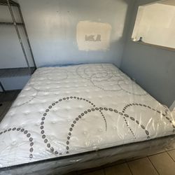 Brand new mattress and New metal base Frame KING