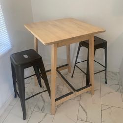 Dining table with two bar stool