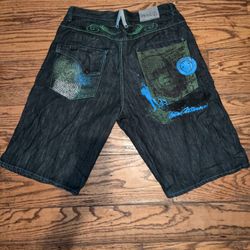 VINTAGE G-UNITDENIM CO. 100$ bill design. (100% cotton) Size 38X15 ( there are 2 damaged areas on the jorts, One small hole in the front right leg. An