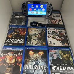 Sony  Playstation Vita + 8 Games 
