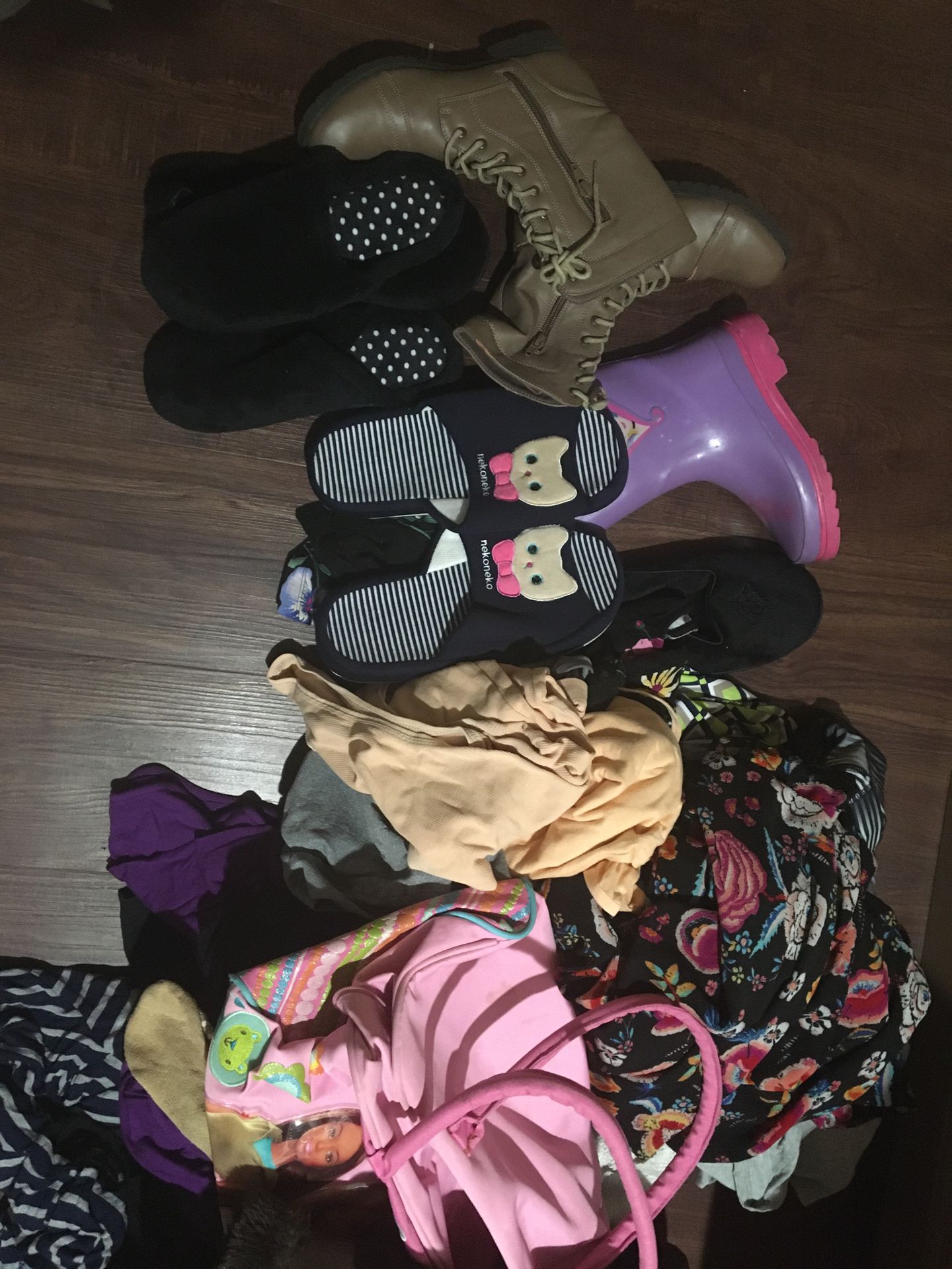 Pending pickup -Free. Bag full of women’s and girl’s clothing and shoes.