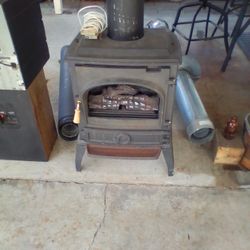 One Gas Stove And Pipe  Made By. Dovre  , Model.    DV400