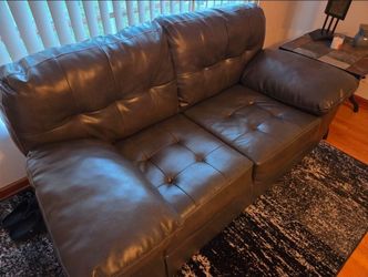 Leather Love Seat with tables and Lamp
