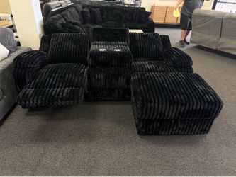Reclining sofa with storage and cupholders