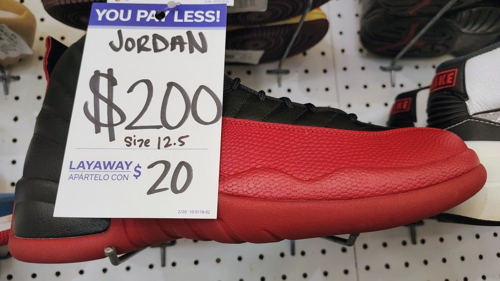 

This is a pair of Air Jordan 12 "Flu Game" sneakers. 