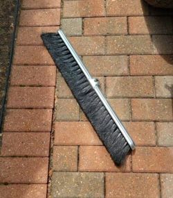 Brand New Milwaukee Dustless 24-in Broom Sweeper