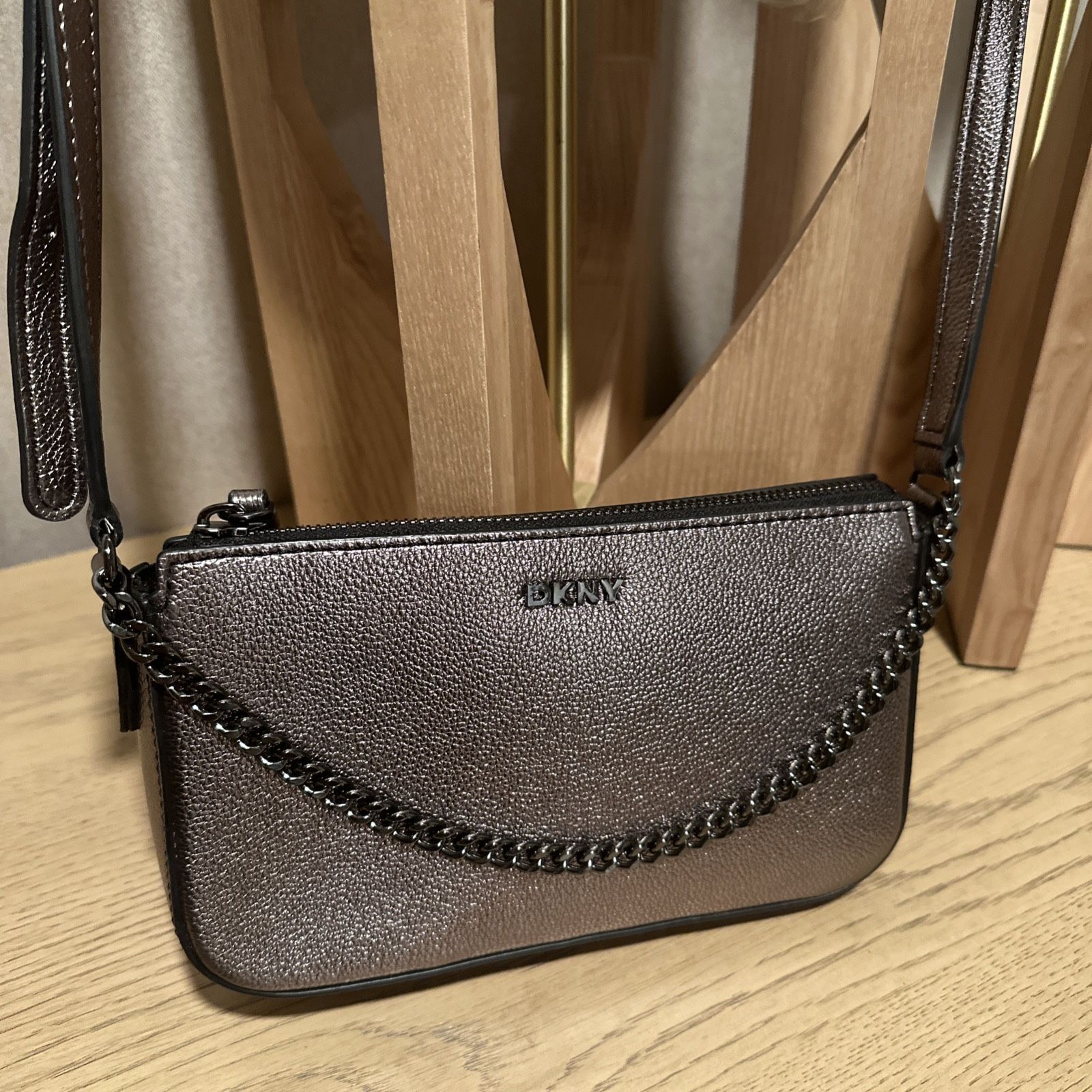 DKNY Women's Crossbody Bag In A Metallic Copper Color Adjustable Strap Zip Close