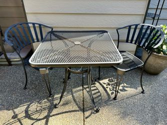 Metal table with two chairs