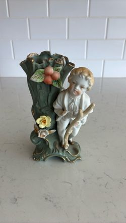 Vintage porcelain vase with boy