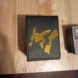 Pikachu black and gold box card holder/ Stack of random pokemon cards
