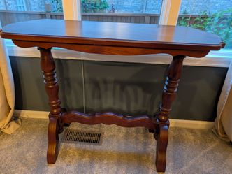 Elegant wooden table with carved legs