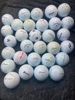 30 used golf balls