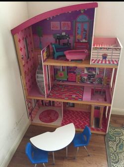 Kids play doll house with furniture