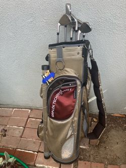 Golf Bag with Clubs and Tees and balls