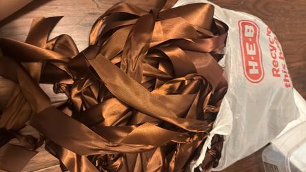 Bag full of assorted cut brown ribbon