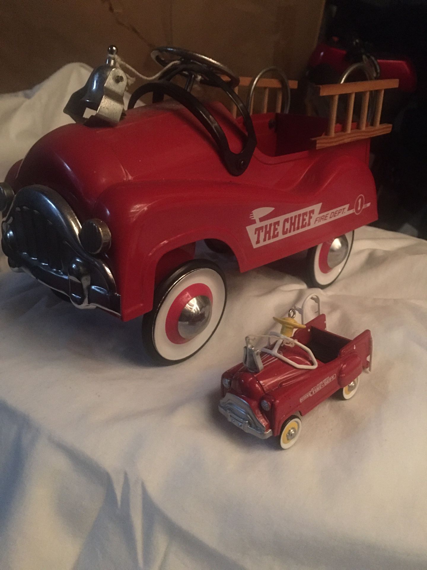 Antique toy firetruck and mini truck