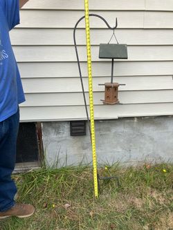 Iron pole hanger with bird suit peanut butter feeder