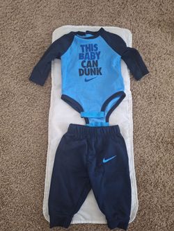 Adorable Nike Dri-FIT baby outfit set in size 6 months! This sporty 2-piece set includes a long-sleeve bodysuit with the fun phrase "This Baby Can Dun