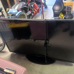 55 Inch Television  With Table W/ Mount Attached