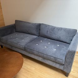 Comfy Blue Couch With Floral Buttons