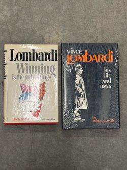 Two books on Vince Lombardi. One is still sealed in plastic.