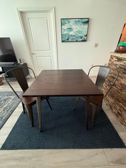 Two-person kitchen table set with matching chairs