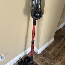 Vacuum stick with wall mount
