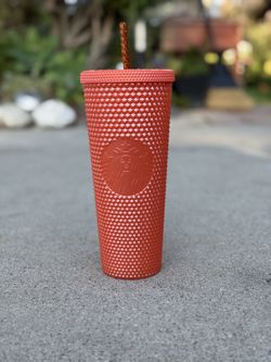 Orange Studded Starbucks Cup. 