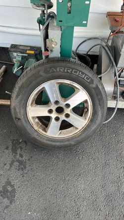 Used Arroyo A/S (all-season) tire on an OEM alloy wheel