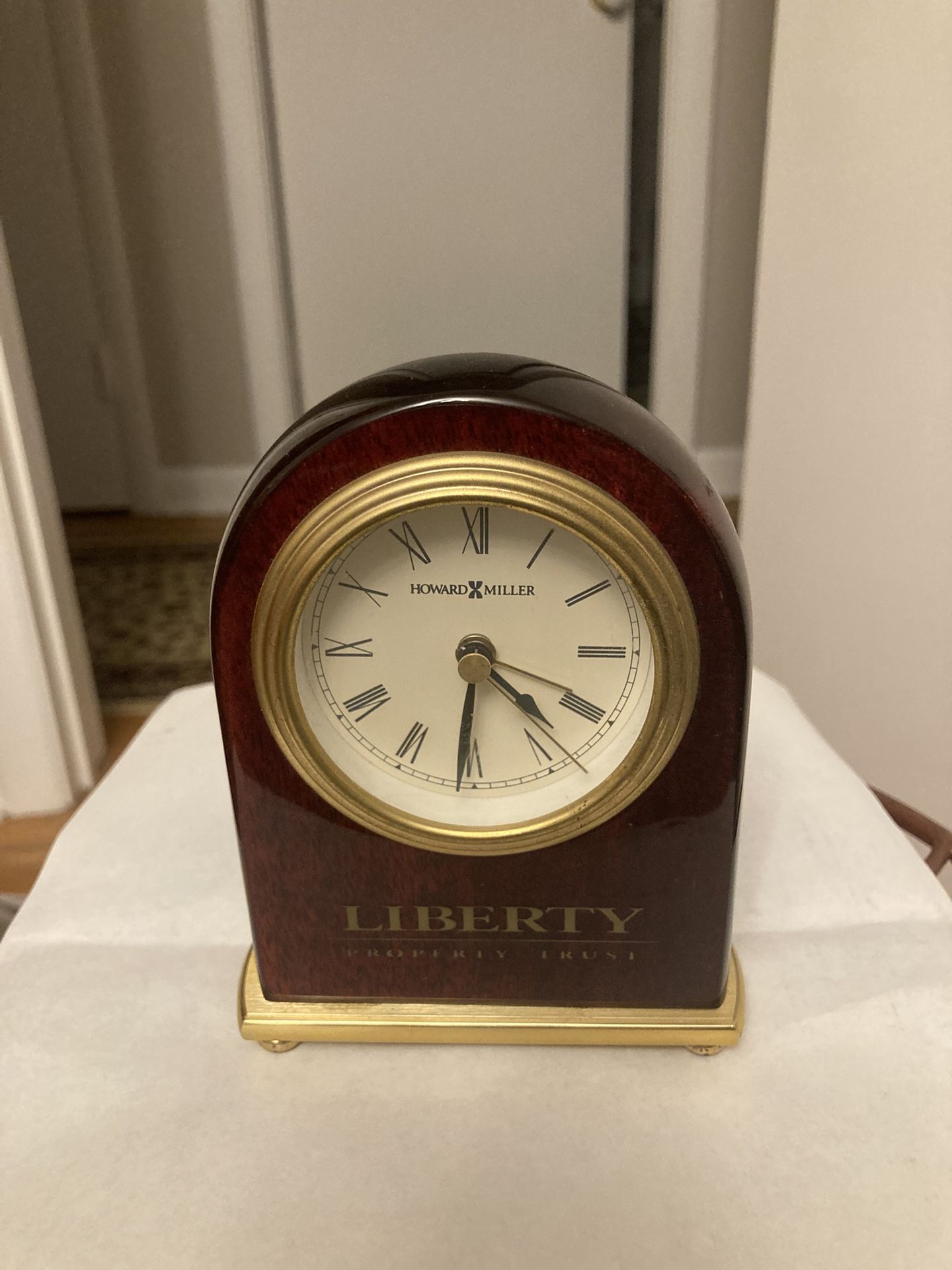 Howard Miller clock. “Liberty property trust “ on bottom of the clock