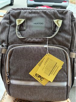 Diaper bag with changing station
