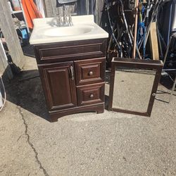 Prices firm.. .. beautiful 25x22 bathroom vanity sink with medicine cabinet