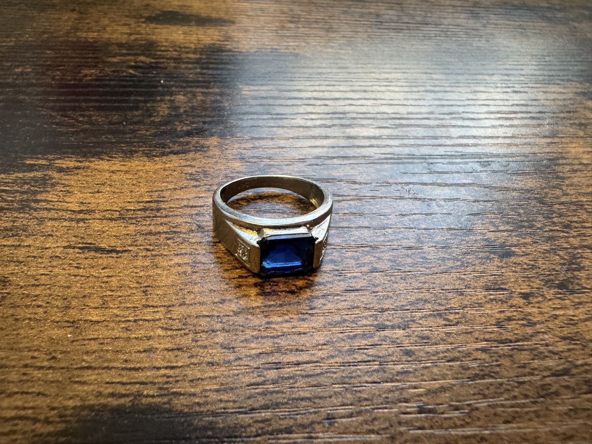 sterling silver ring with a blue sapphire stone