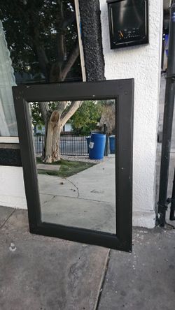 Mirror with wood around