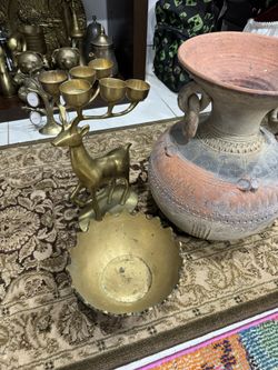 A deer with a jar and a plate