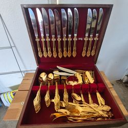 Gold plated ESTIA flatware for 12
