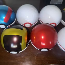 9 empty poke ball tins 