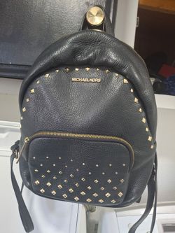 Mochila buenas condisiones  mk original