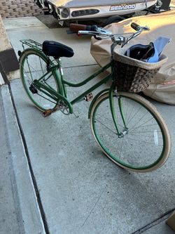 7 speed green cruiser bike with front basket