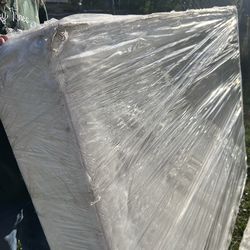 Queen size boxspring and mattress $30 it has a plastic around it