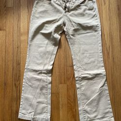 This is a pair of khaki (light beige) casual trousers for women.   1. Brand and Series • Brand: YISHION SPORTS (Yishion Sports Series). "Yishion" is a