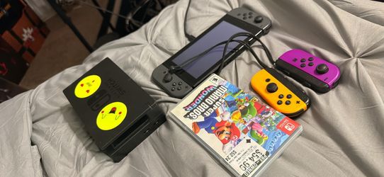 Nintendo Switch with a game and joy cons