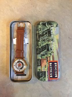 Lionel collectible Train Watch ... Brand New in tin case. Train moves as second hand would. Leather band.